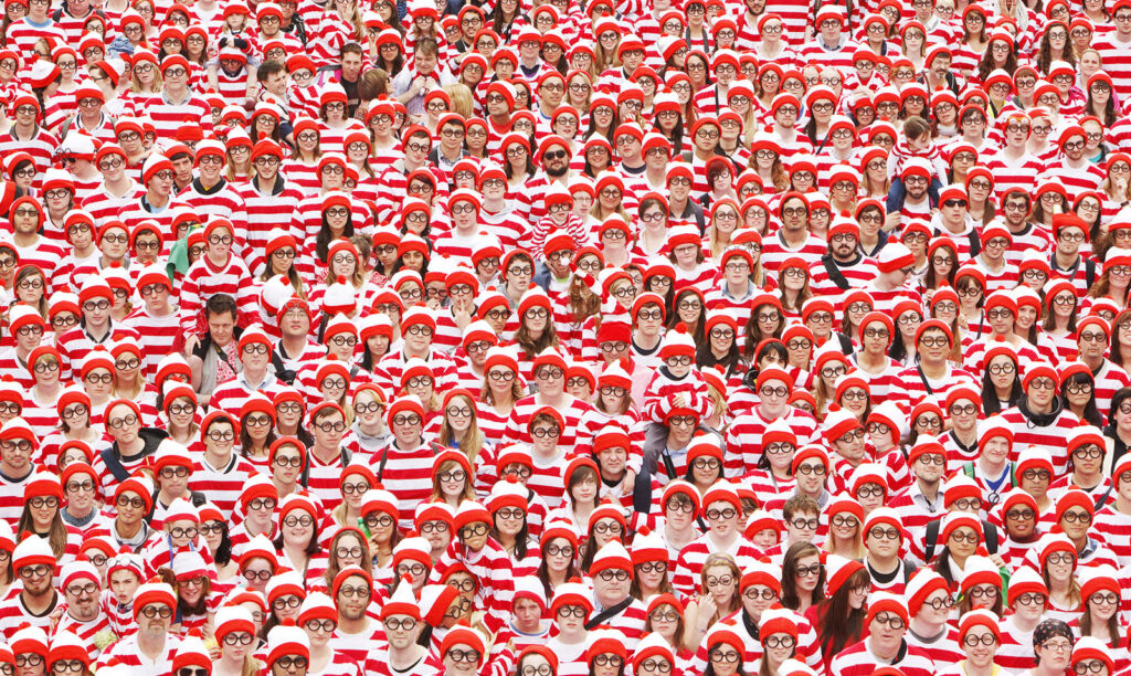 A massive crowd of people dressed as Where's Waldo.