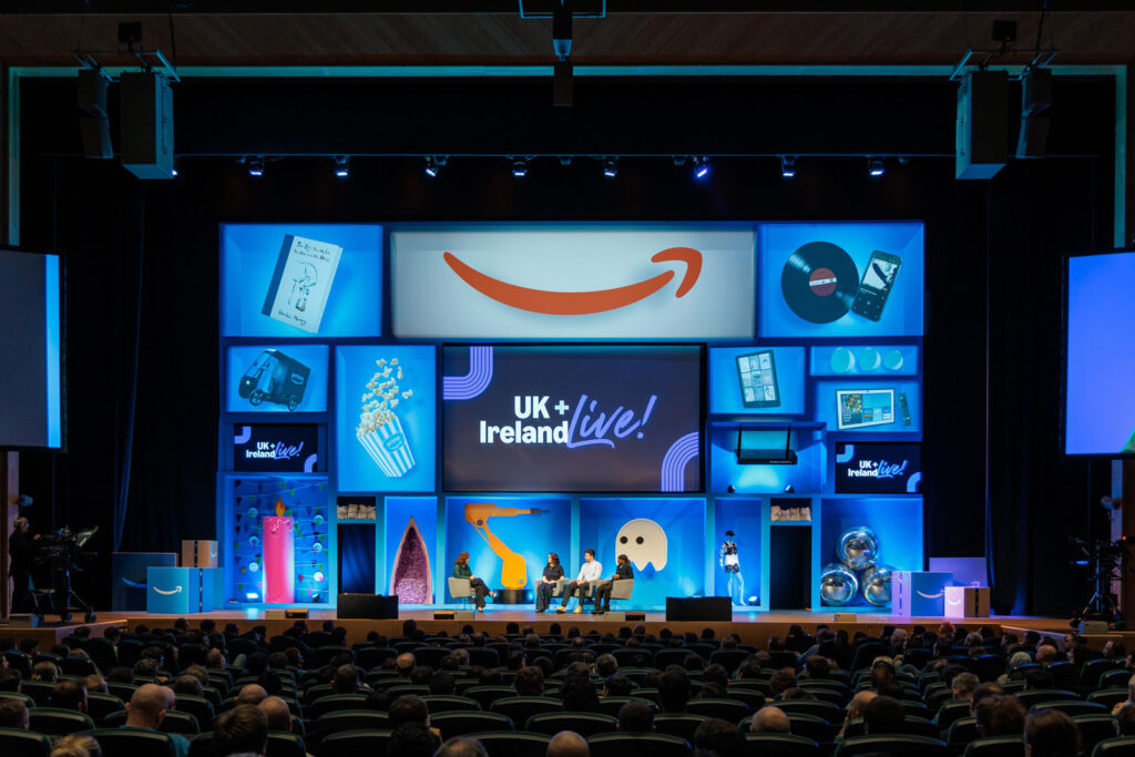 Amazon UK + Ireland Live! conference with audience and product displays.
