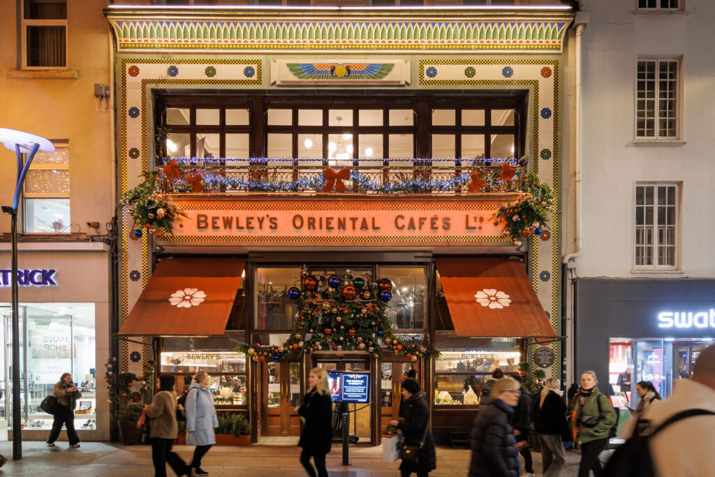 Bewley's Oriental Cafés at night, adorned with festive Christmas decorations.