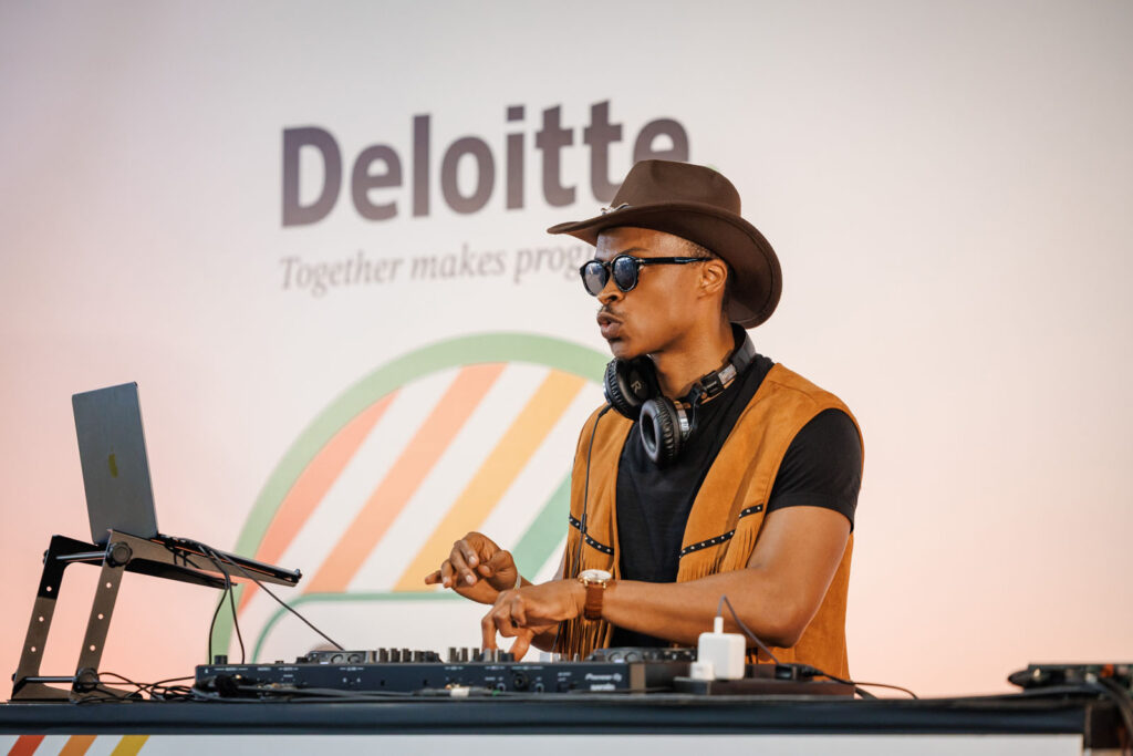 DJ performing at a Deloitte event