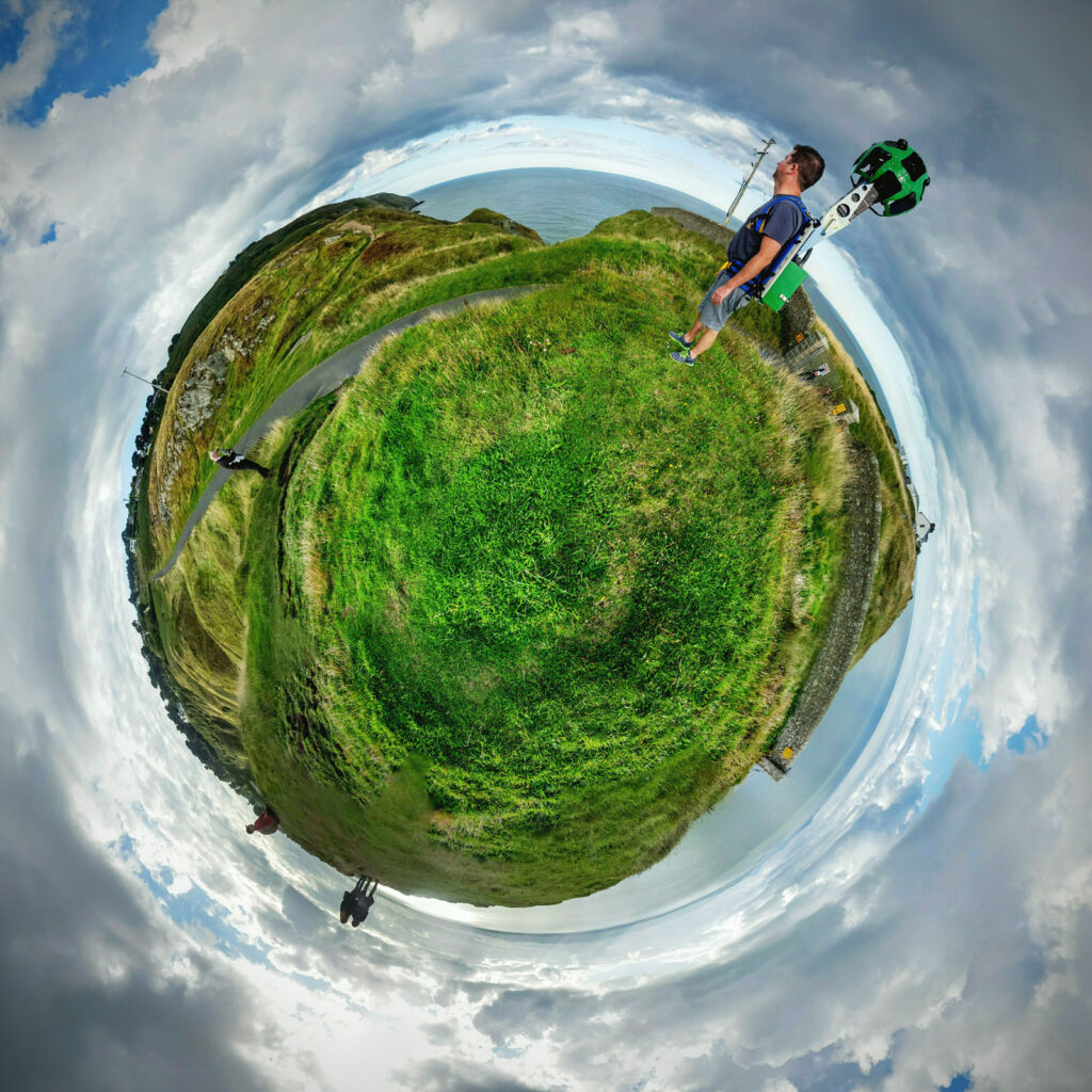Google Street View mapping coastal path in tiny planet view.