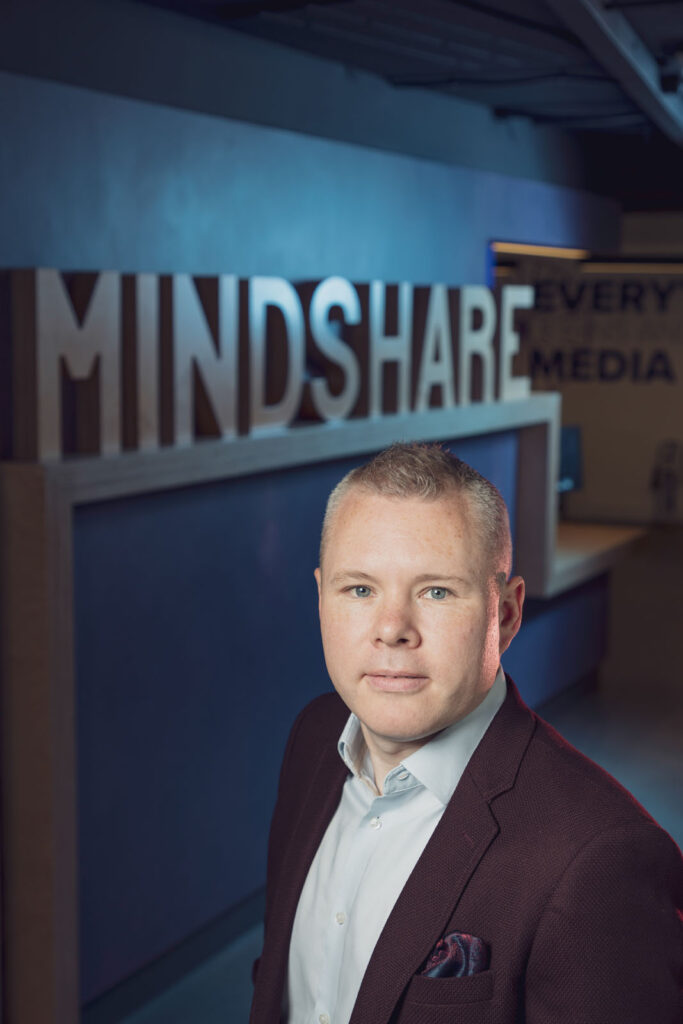 Man in business attire at Mindshare.
