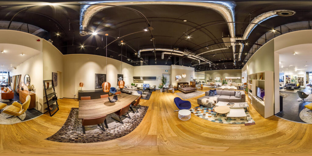 Modern furniture showroom displaying diverse home interior setups.