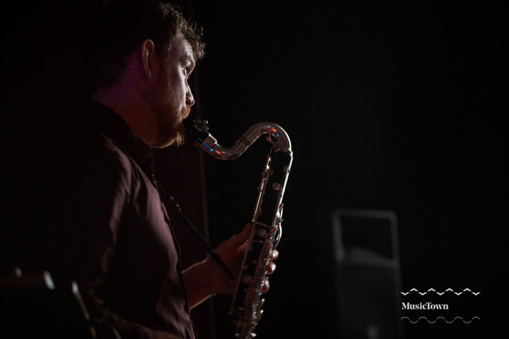 Musician performing with saxophone