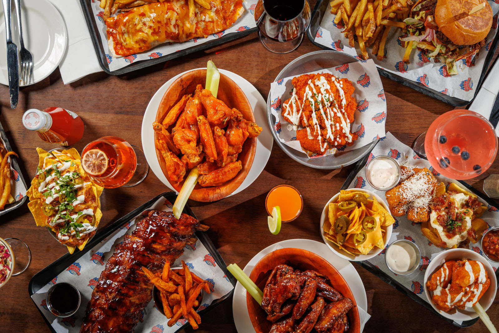 Overhead shot of a diverse American comfort food spread.
