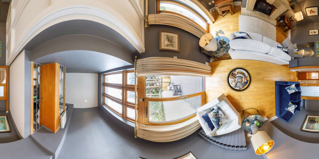 Panoramic view of a stylish, modern living room interior.