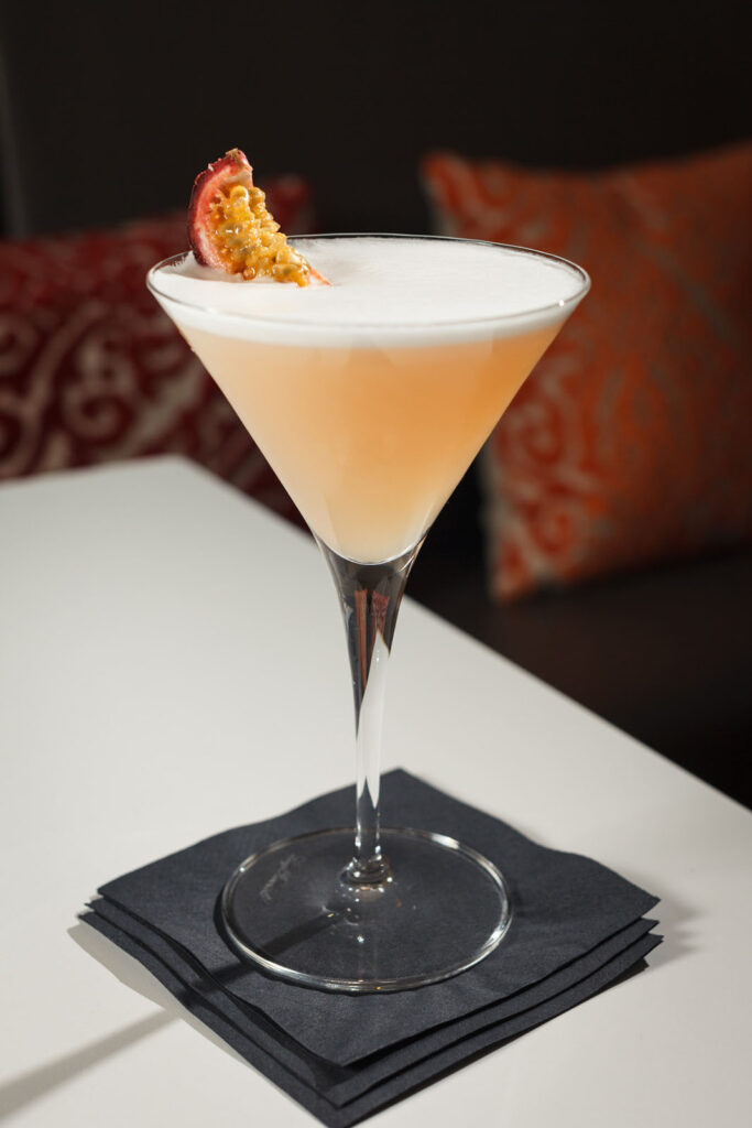 Passion fruit cocktail in martini glass