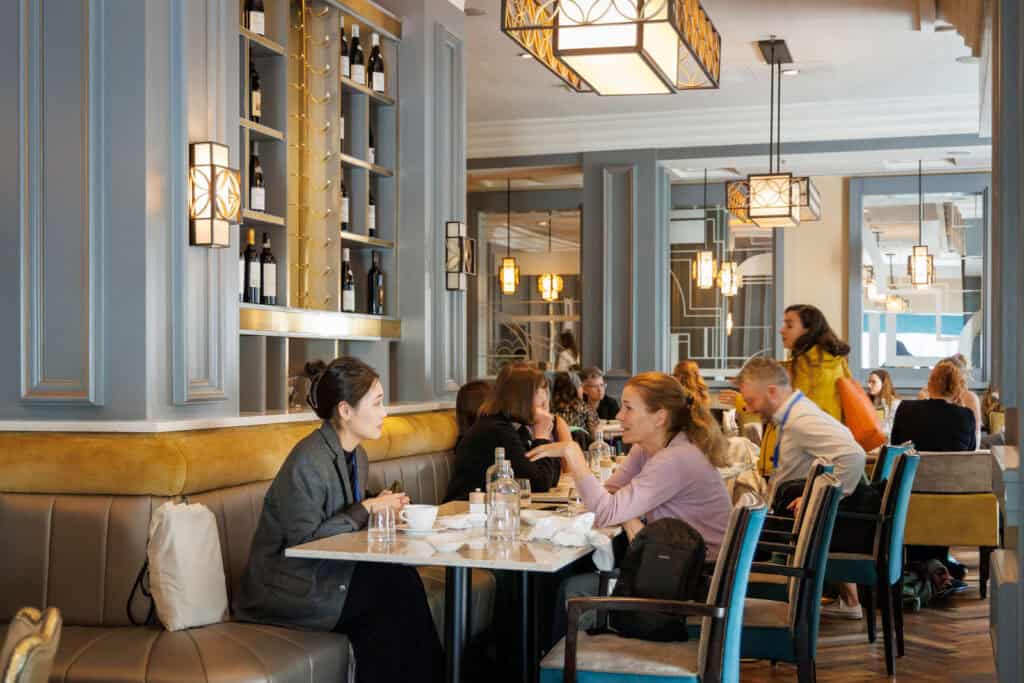 People dining and socializing in a stylish restaurant.