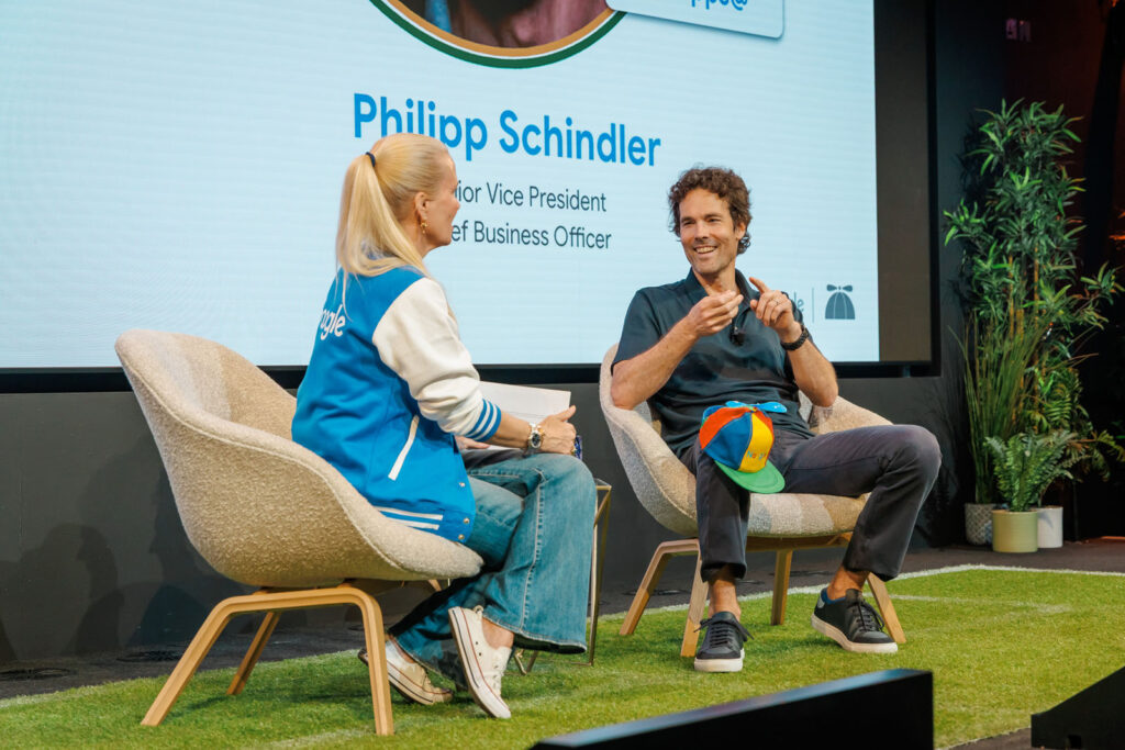 Philipp Schindler, Senior Vice President, Chief Business Officer, smiles during a presentation.
