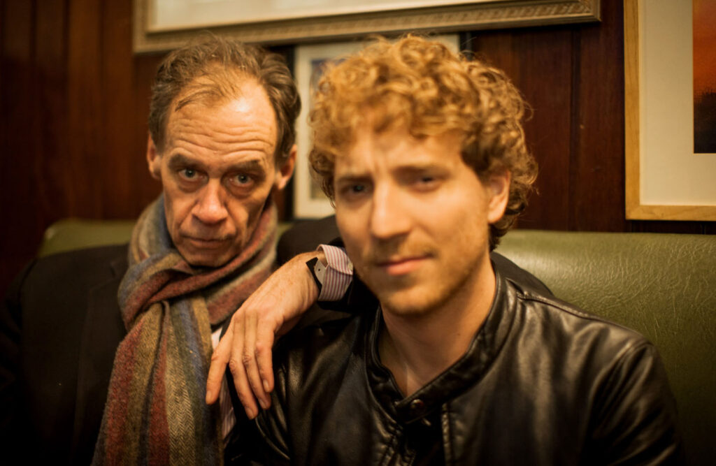 Portrait of two men, one older, one younger.