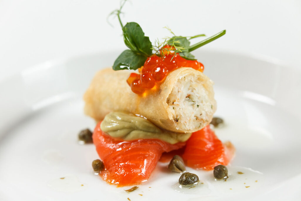 Spring roll with salmon roe, smoked salmon, and capers.