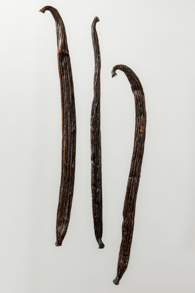 Three dark vanilla pods.