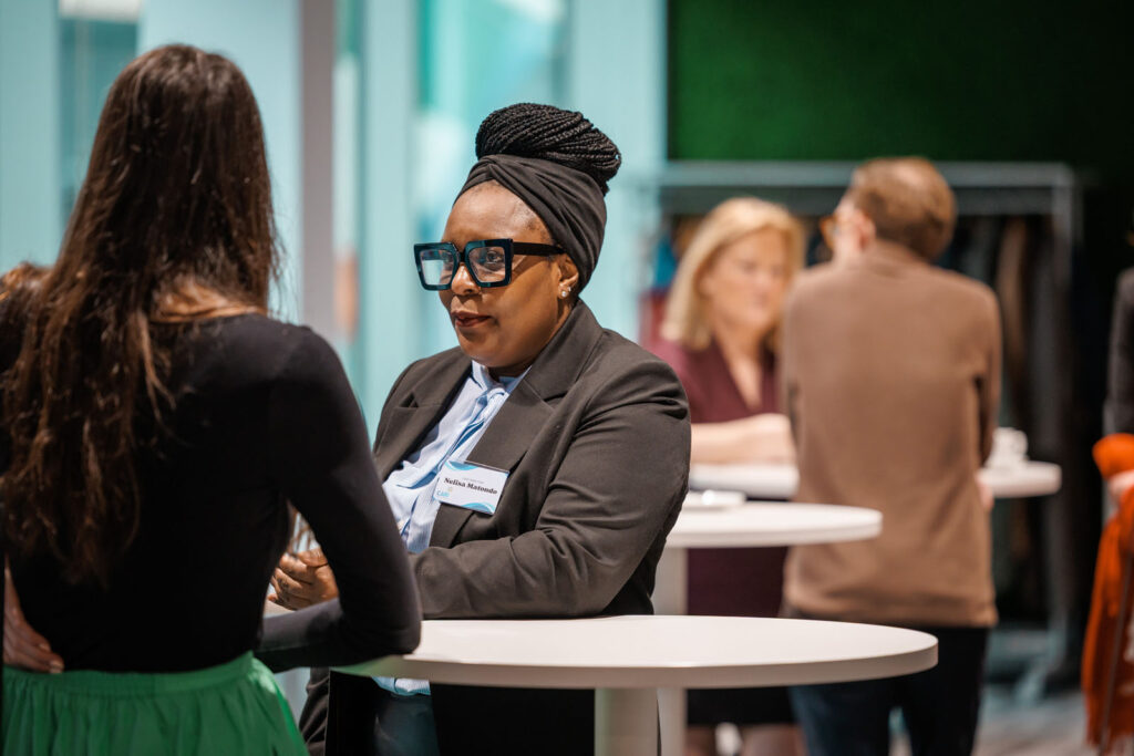 Women networking at an event.